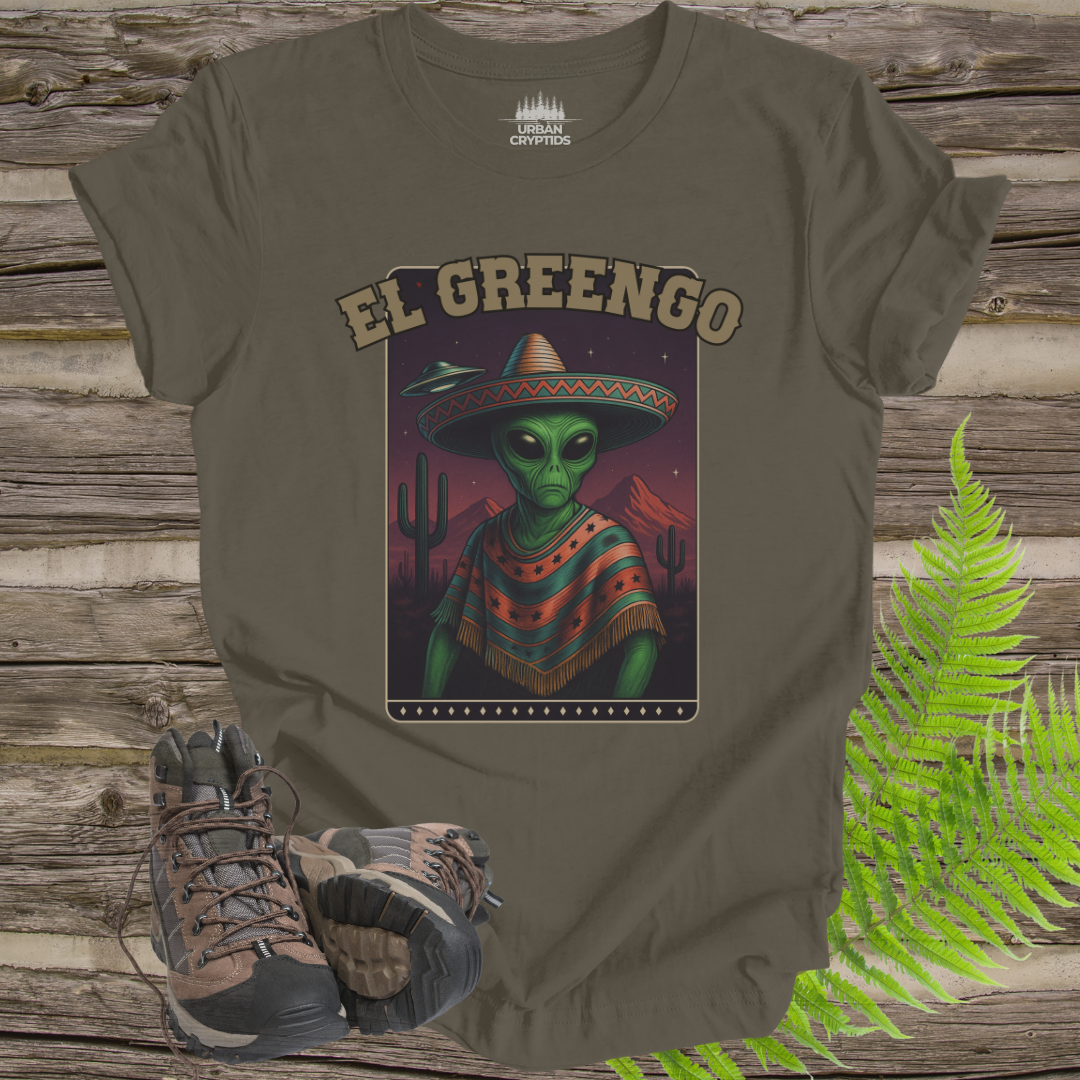 T-shirt with alien wearing a sombrero design labeled 'El Greengo' on a wooden background.