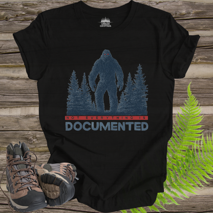 “Not Everything Is Documented” Bigfoot T-Shirt – Cryptid Warning Statement Tee