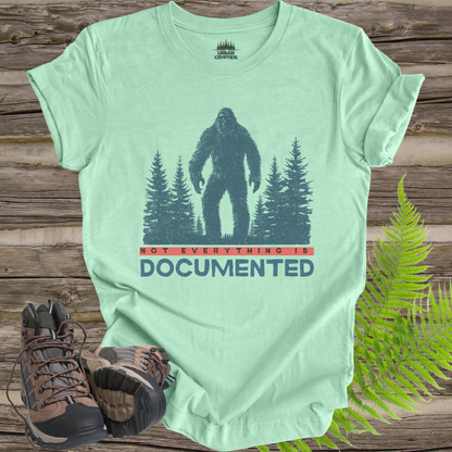 “Not Everything Is Documented” Bigfoot T-Shirt – Cryptid Warning Statement Tee