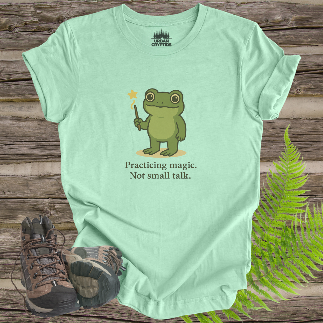 Loveland Frogman “Practicing Magic, Not Small Talk” Tee – Funny Cryptid Shirt for Paranormal Fans