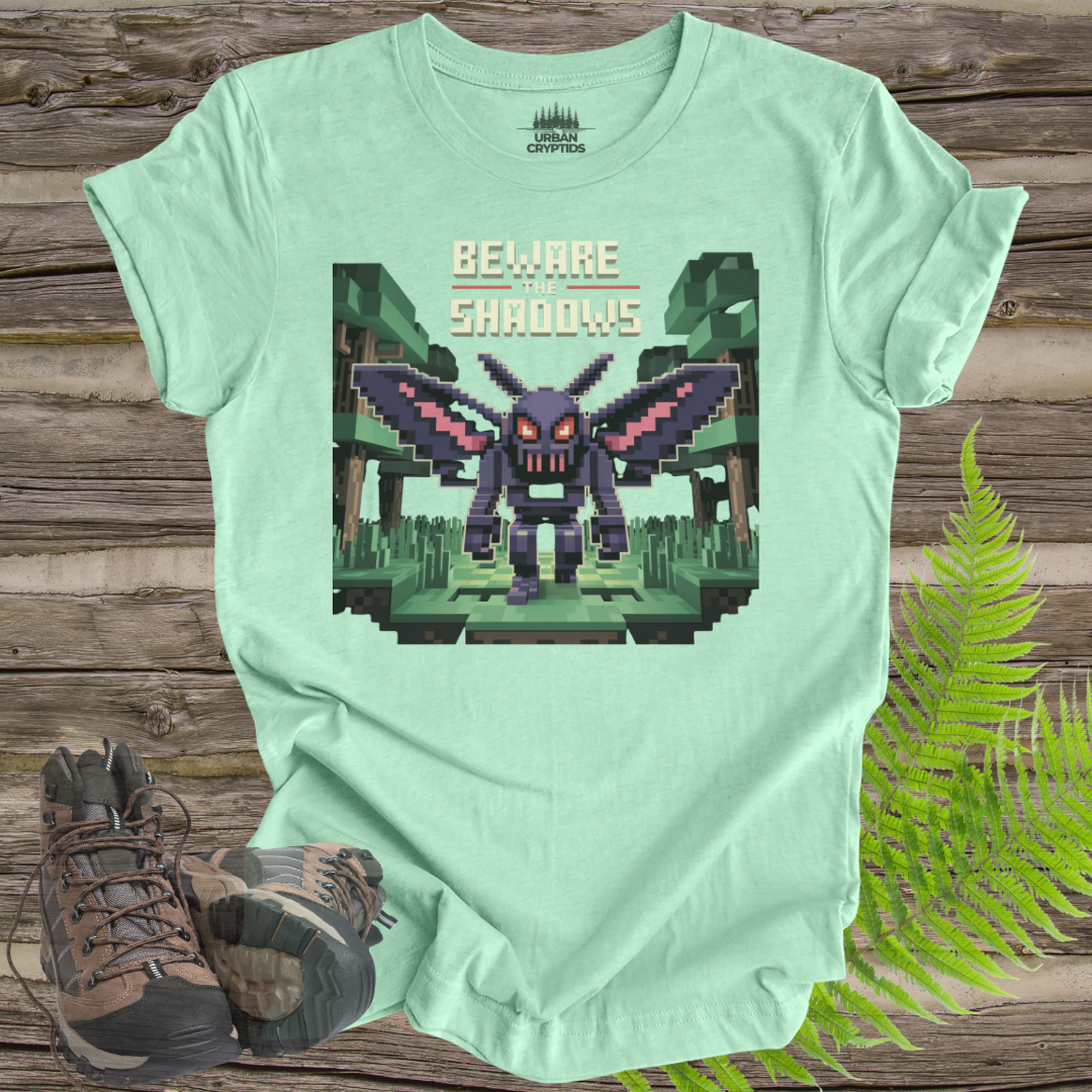 Beware the Shadows – Pixel Mothman T-Shirt