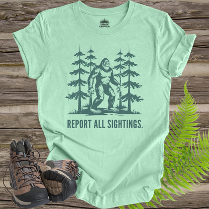 Bigfoot “Report All Sightings” T-Shirt – Vintage Cryptid Forest Design
